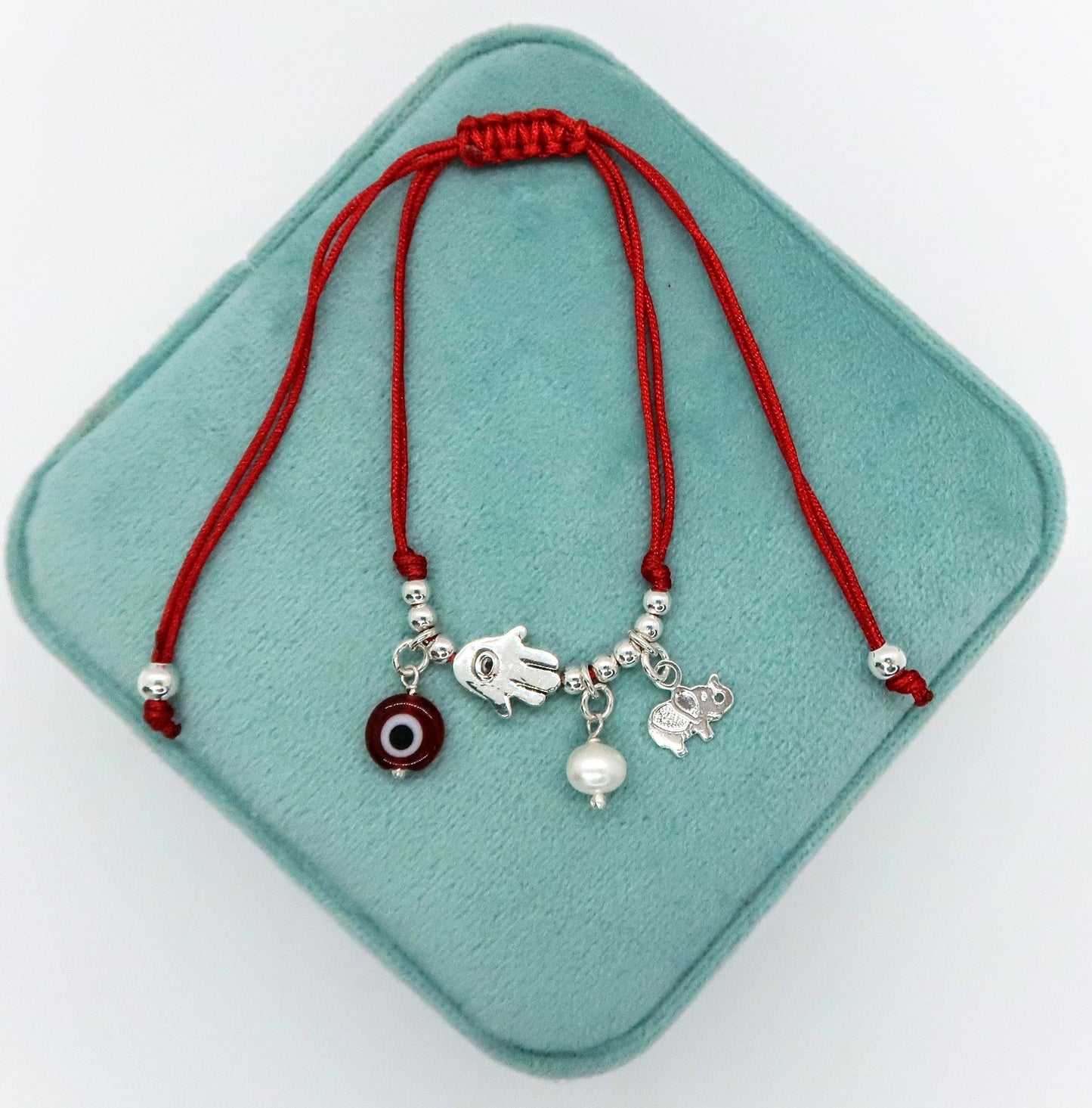 Pulsera de Hilo con Manita de Fatima, Perla Cultivada y Ojito turco