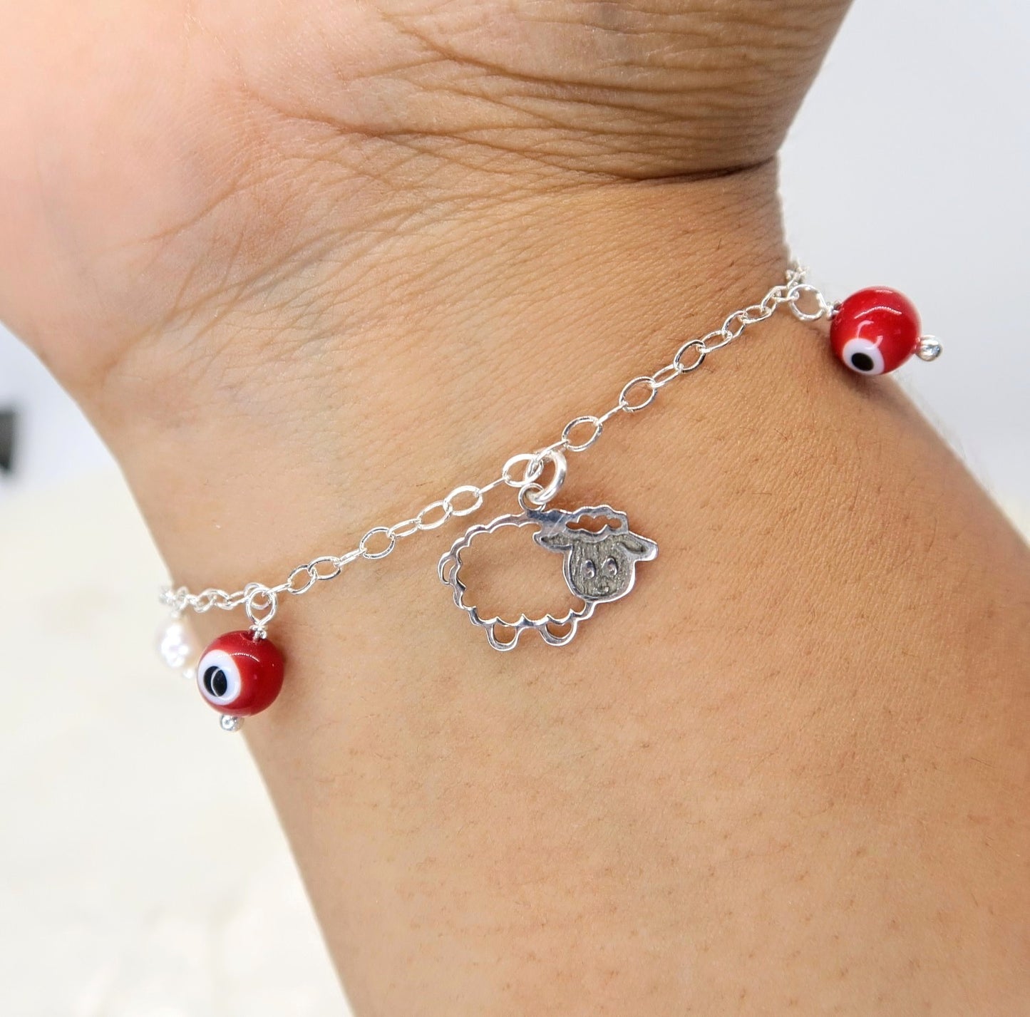 Pulsera Borreguito de la Abundancia, Ojito turco y Perla Cultivada